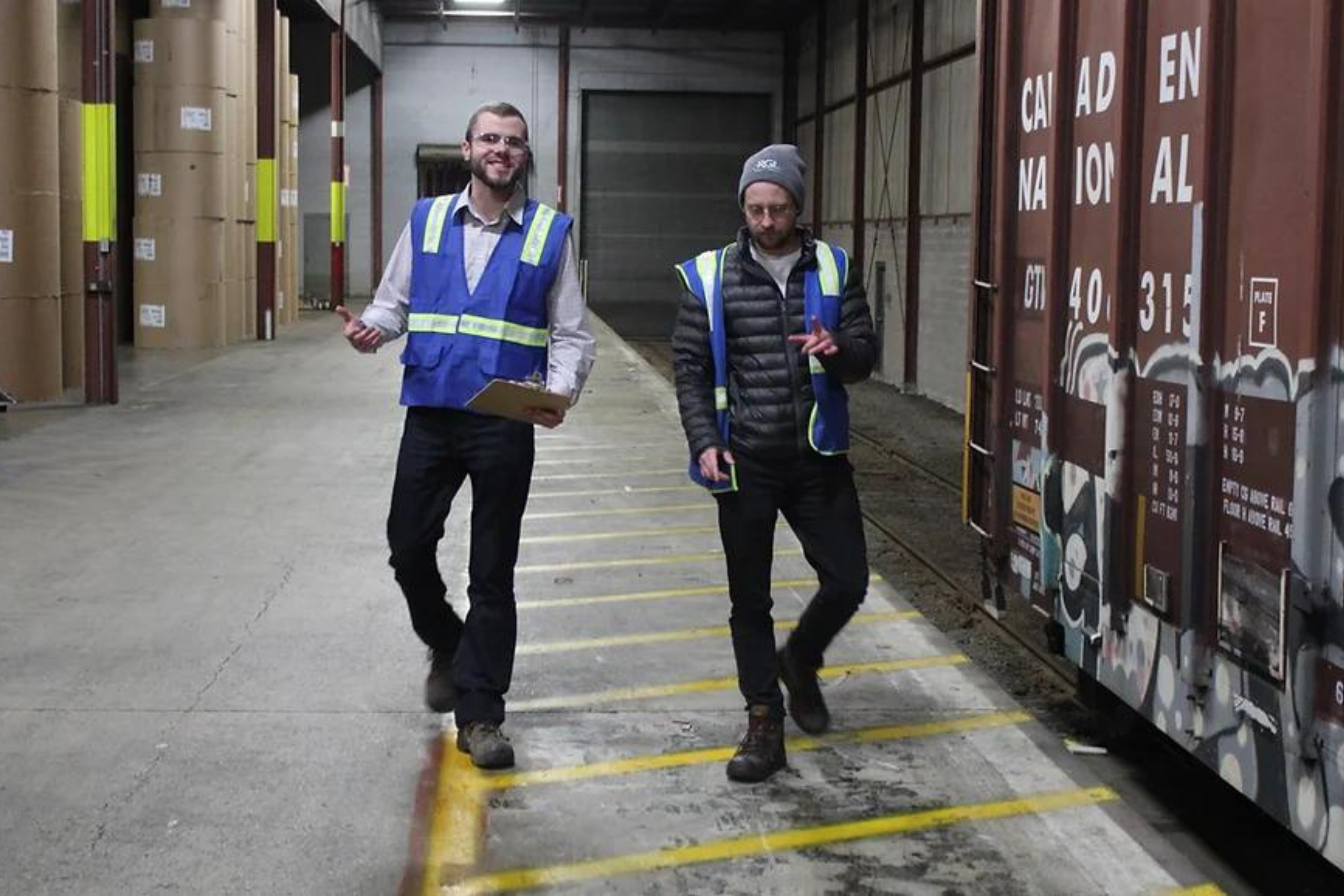 Team leader conversation walking through Donald Street warehouse